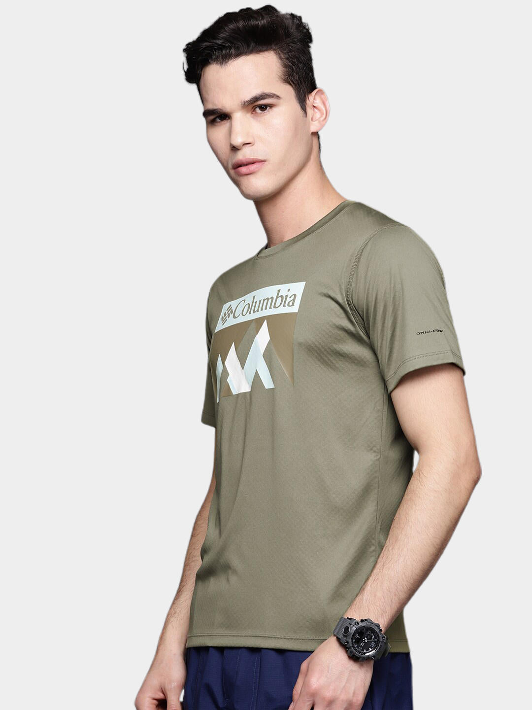 A Men Wearing Columbia Men Green Zero Rules Short Sleeve Graphic Shirt (Sun Protection)