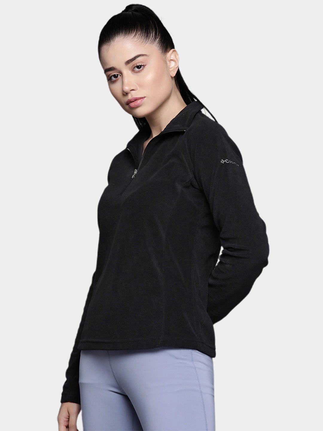 A Women Wearing Columbia Women Black Glacial IV 1/2 Zip