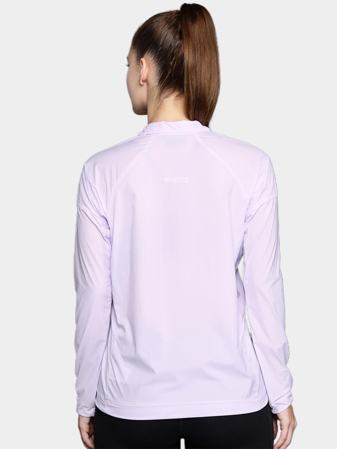 A Women Wearing Columbia Women Purple W Titan Pass Lightweight 1/2 Zip
