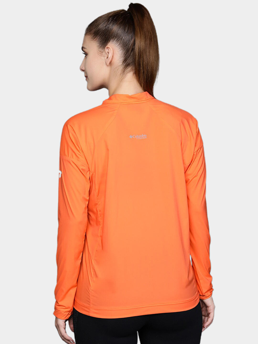 A Women Wearing Columbia Women Orange W Titan Pass Lightweight 1/2 Zip
