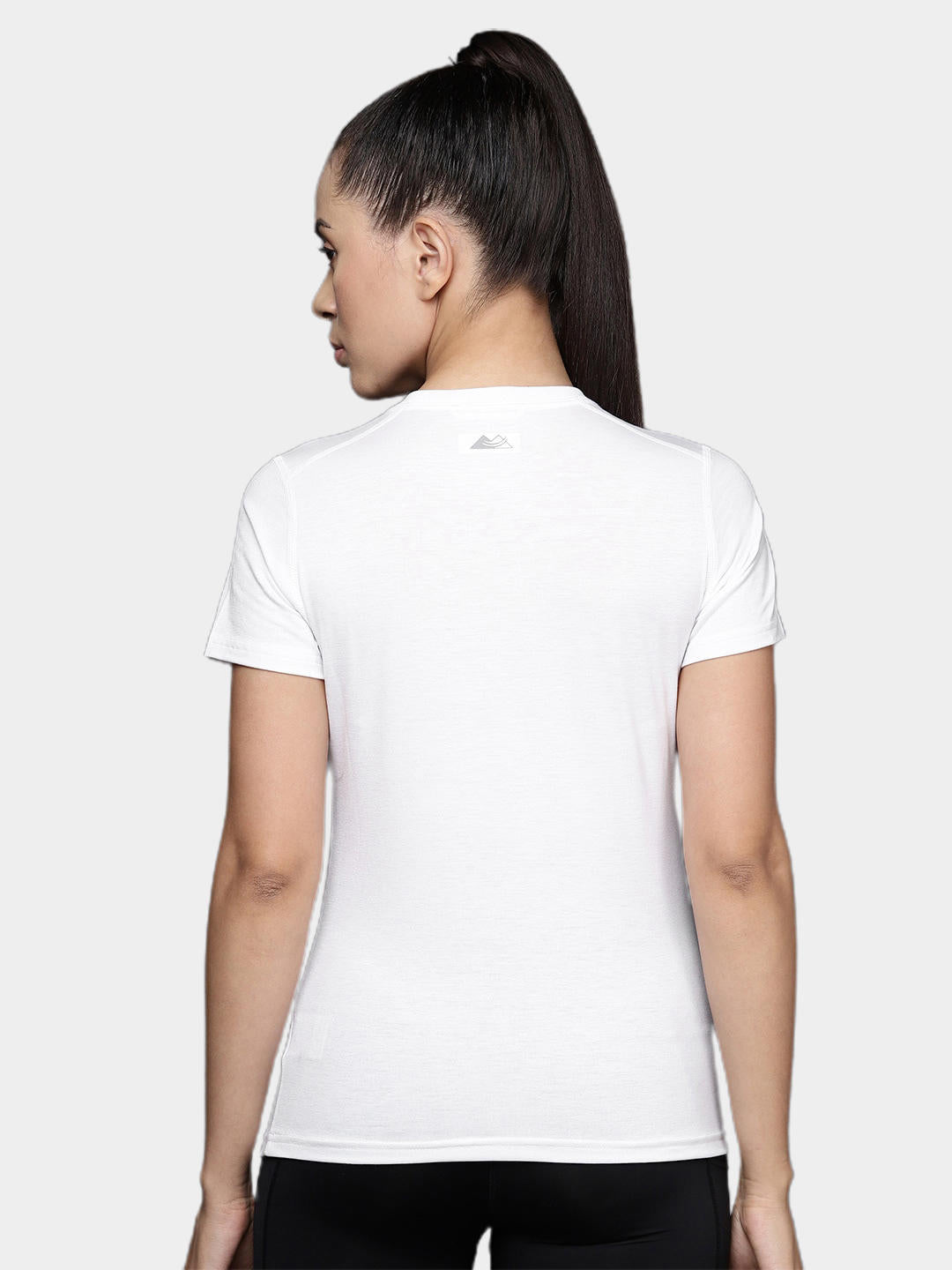 A Women Wearing Columbia Women White W Endless Trail Running Tech Tee