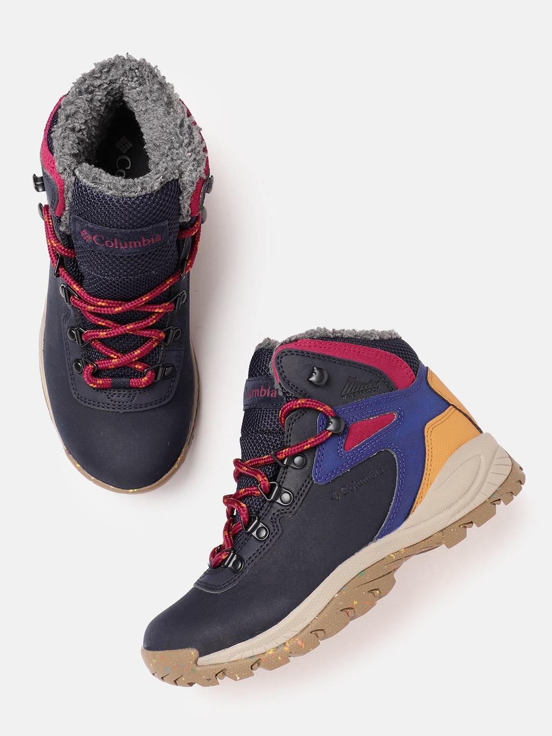 A Women Wearing Columbia Women Navy Blue NEWTON RIDGE PLUS OMNI HEAT