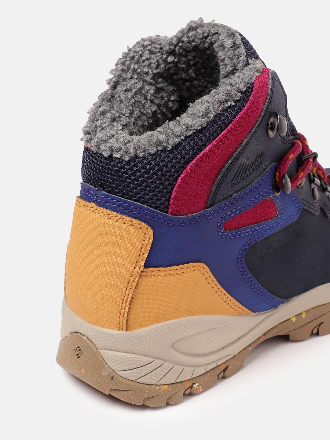 A Women Wearing Columbia Women Navy Blue NEWTON RIDGE PLUS OMNI HEAT