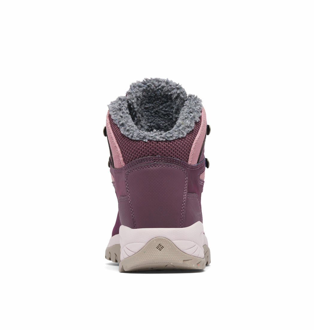 A Women Wearing Columbia Women Red NEWTON RIDGE WP OMNI-HEAT II