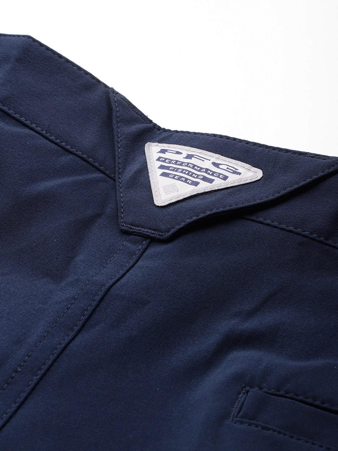 A Men Wearing Columbia Men Blue Grander Marlin III Offshore Short (Sun Protection)