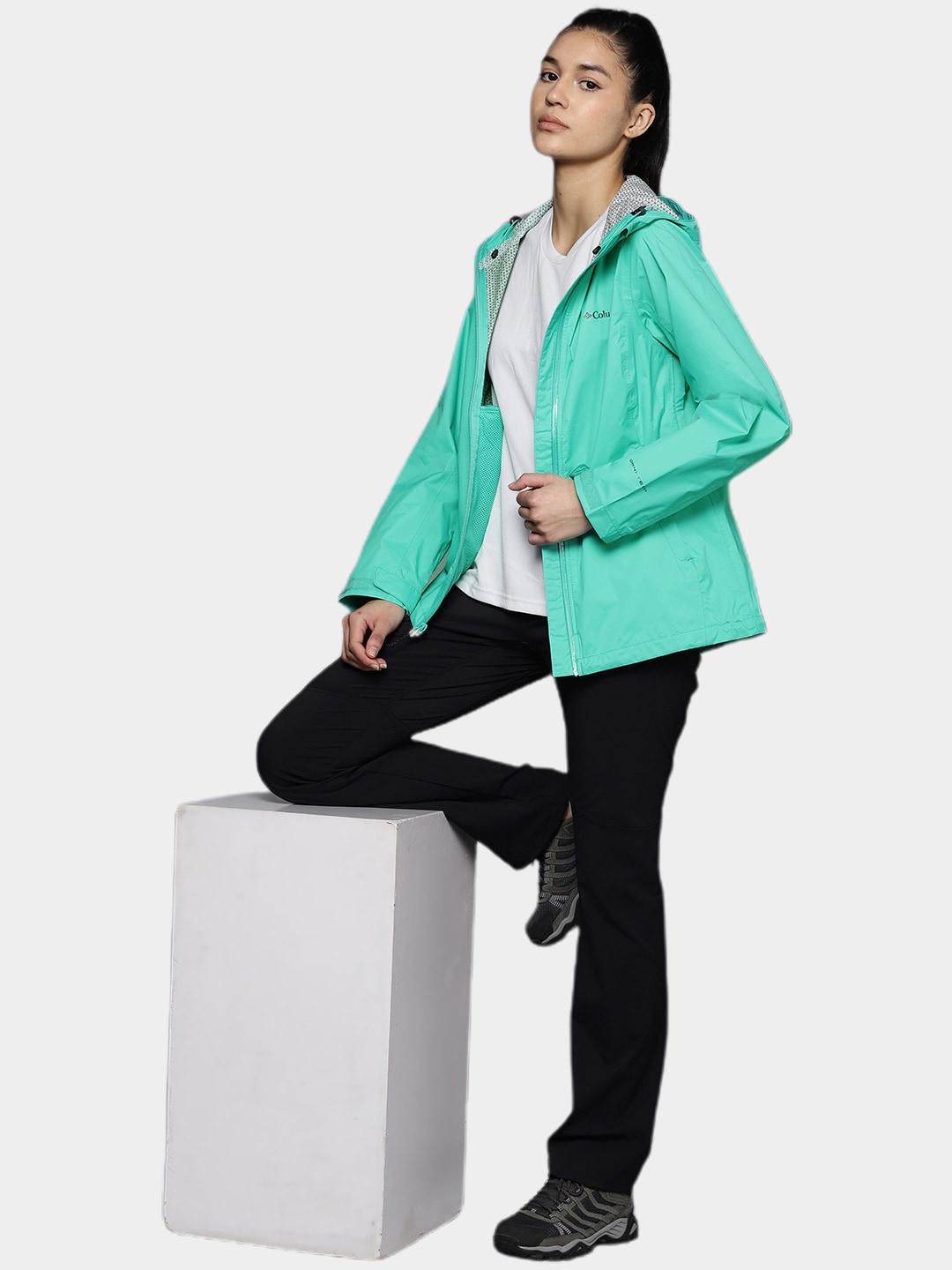 A Women Wearing Columbia Women Green EvaPOURation Jacket Waterproof