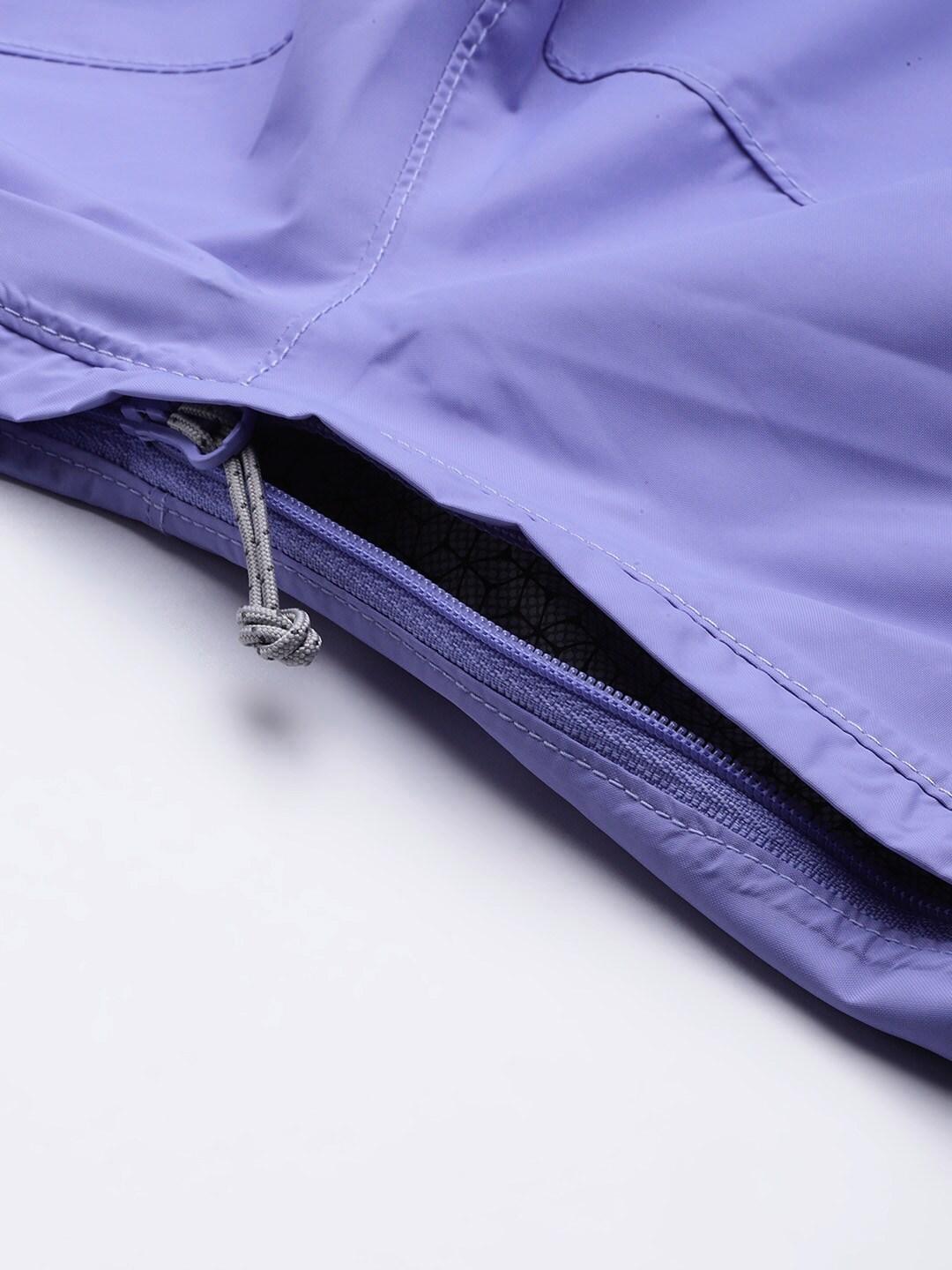 A Women Wearing Columbia Women Purple EvaPOURation Jacket Waterproof