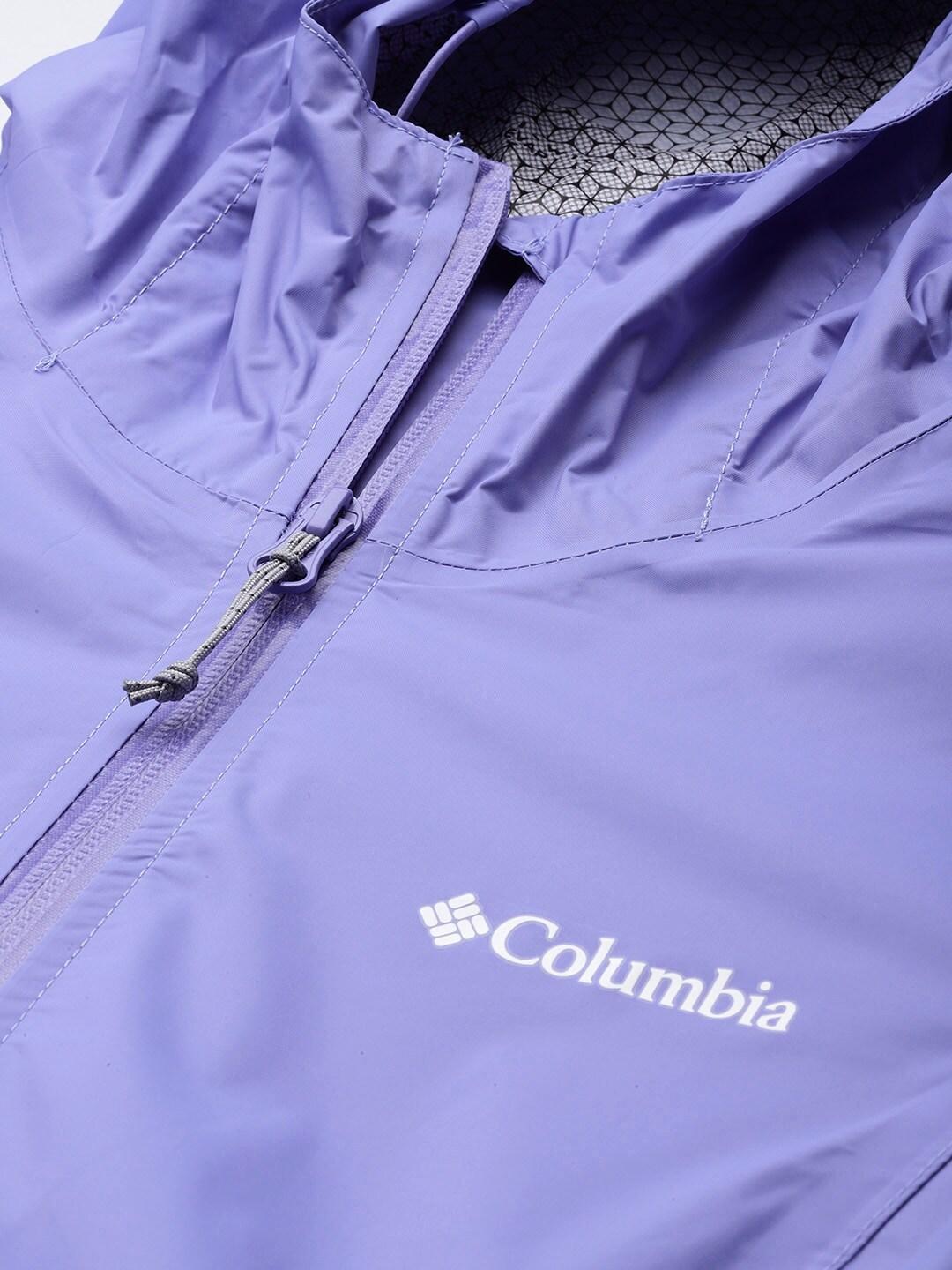 A Women Wearing Columbia Women Purple EvaPOURation Jacket Waterproof