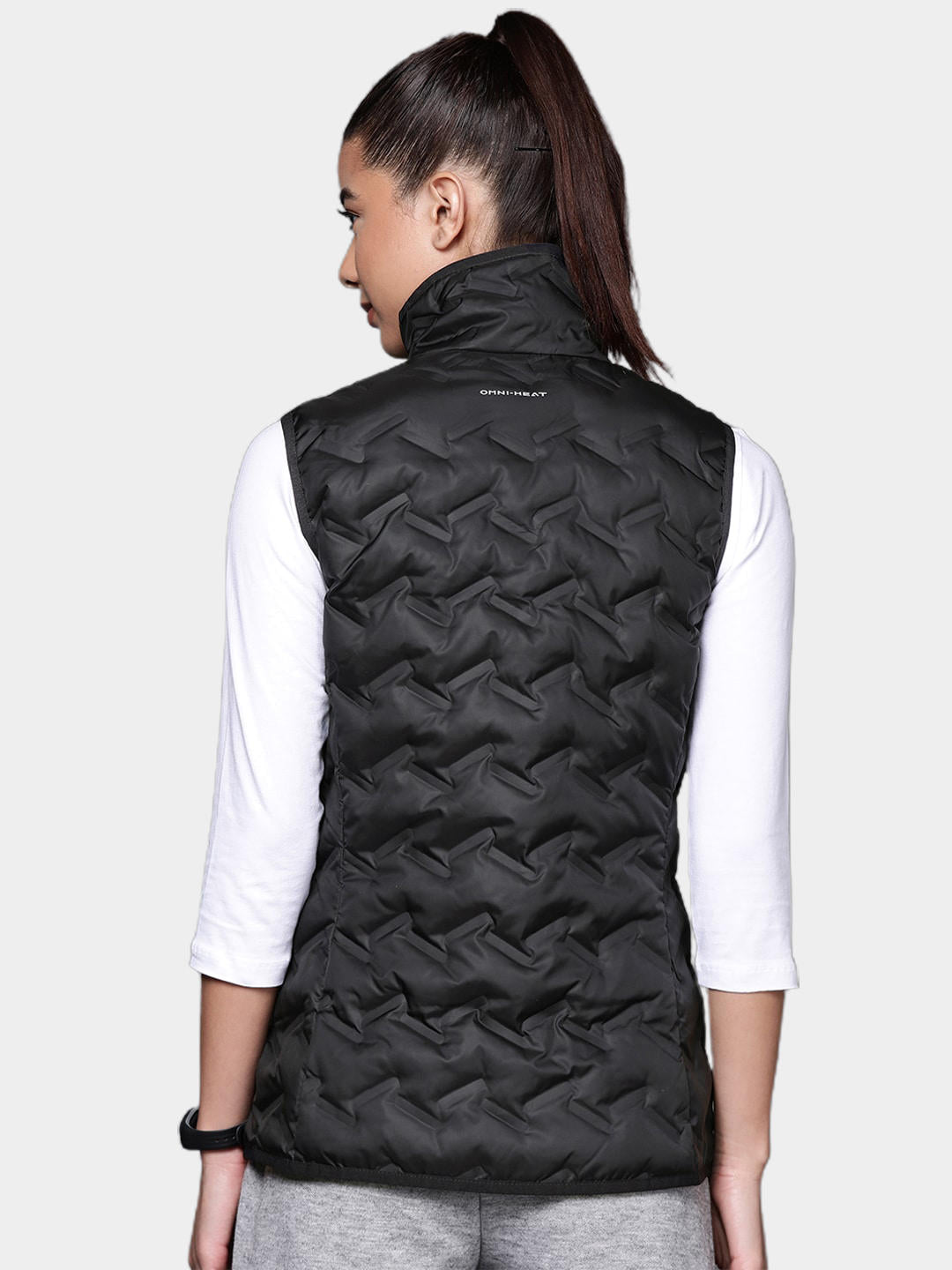 A Women Wearing Columbia Women Black Delta Ridge Down Vest