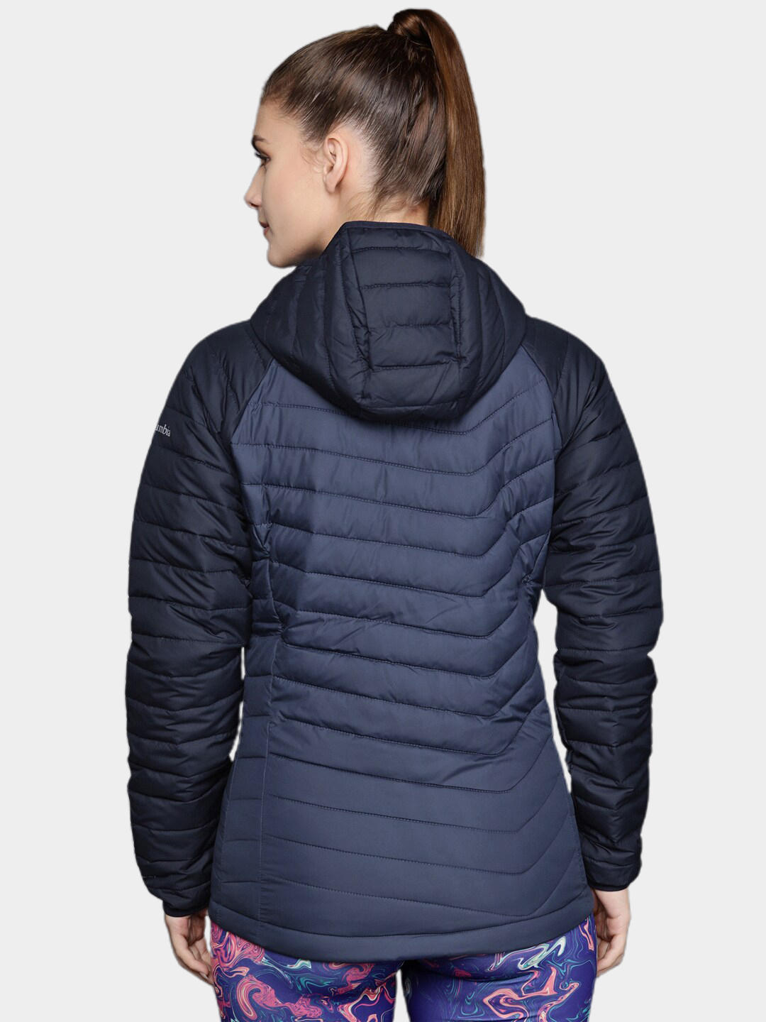 A Women Wearing Columbia Women Navy Blue Powder Lite Hooded Jacket