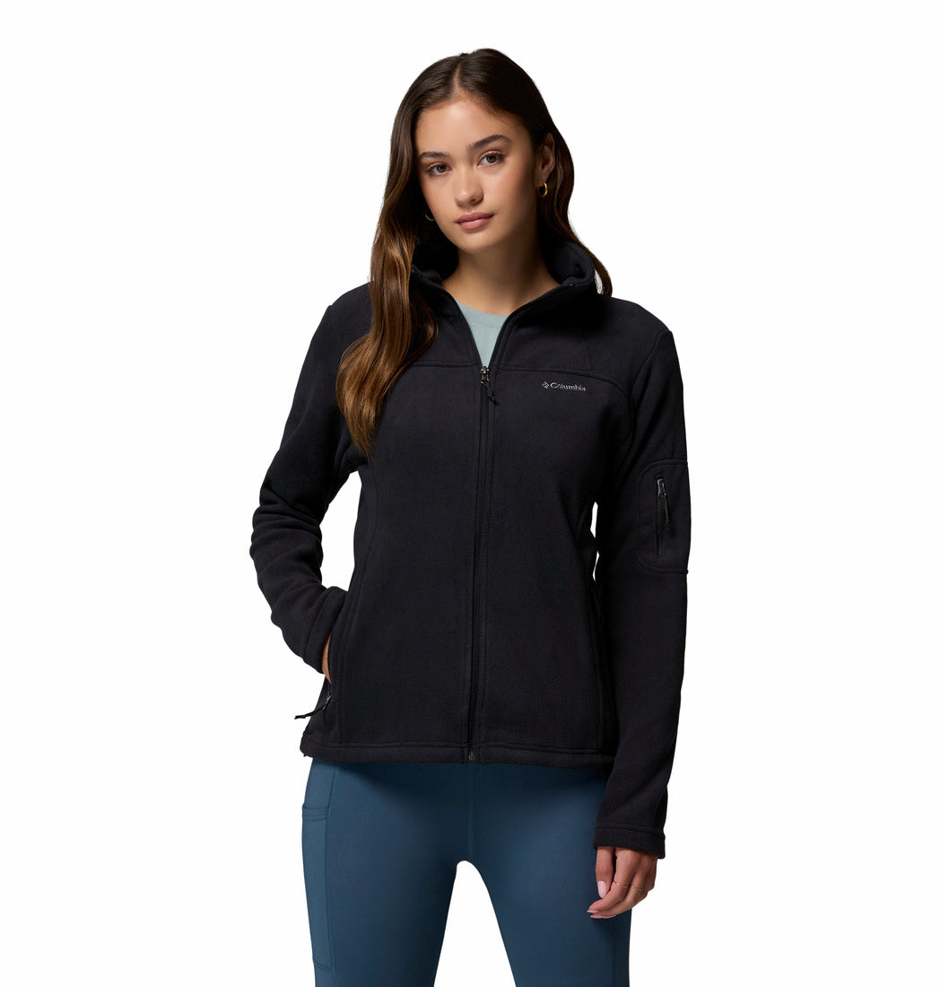 Woman wearing a black jacket with Columbia logo on a white background