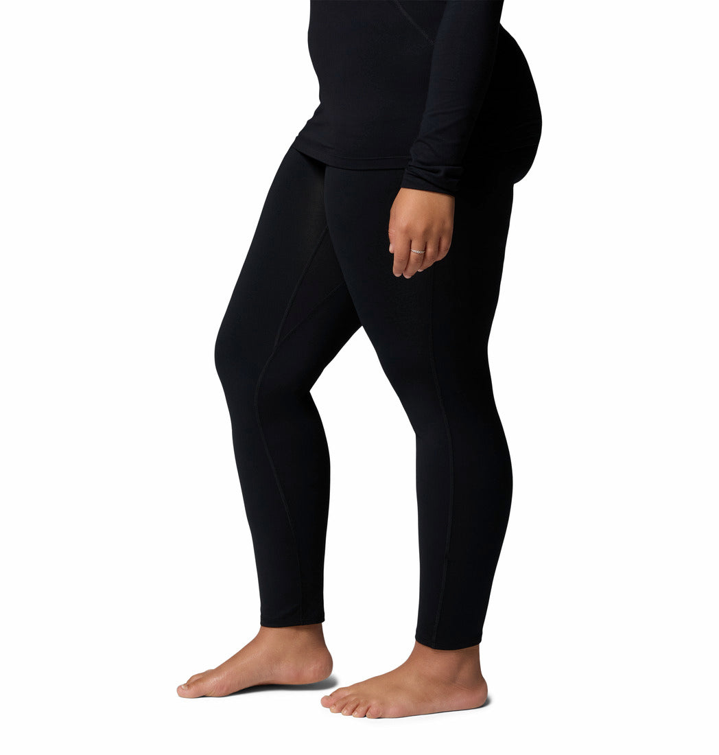 Person wearing black leggings on a white background