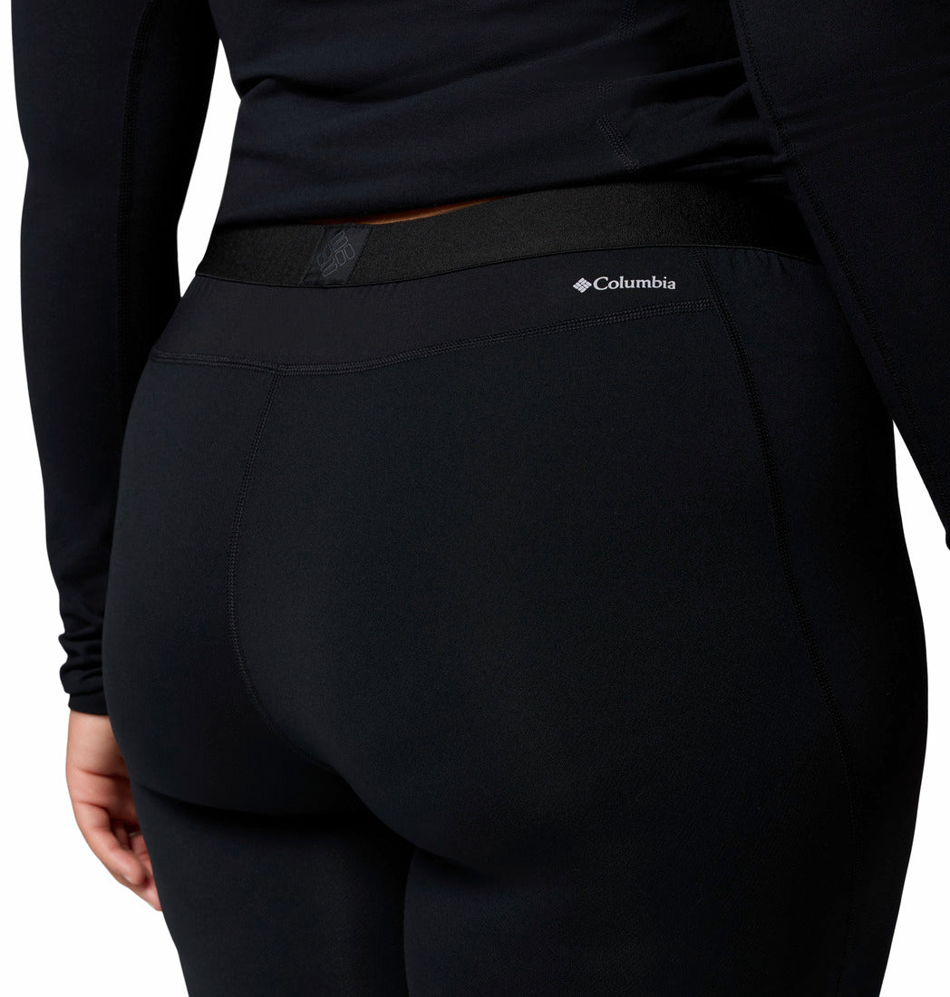 Person wearing black leggings on a white background