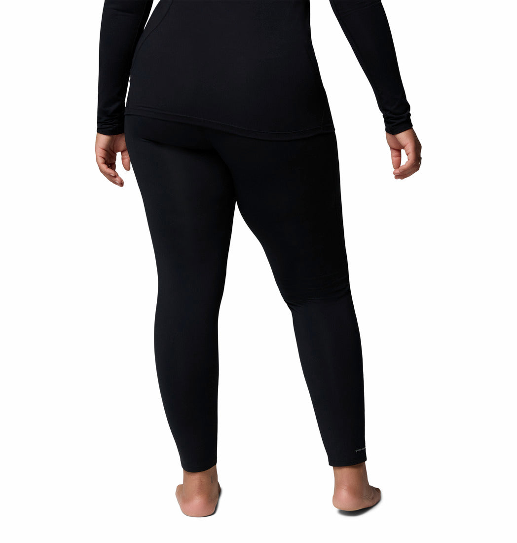 Person wearing black leggings on a white background