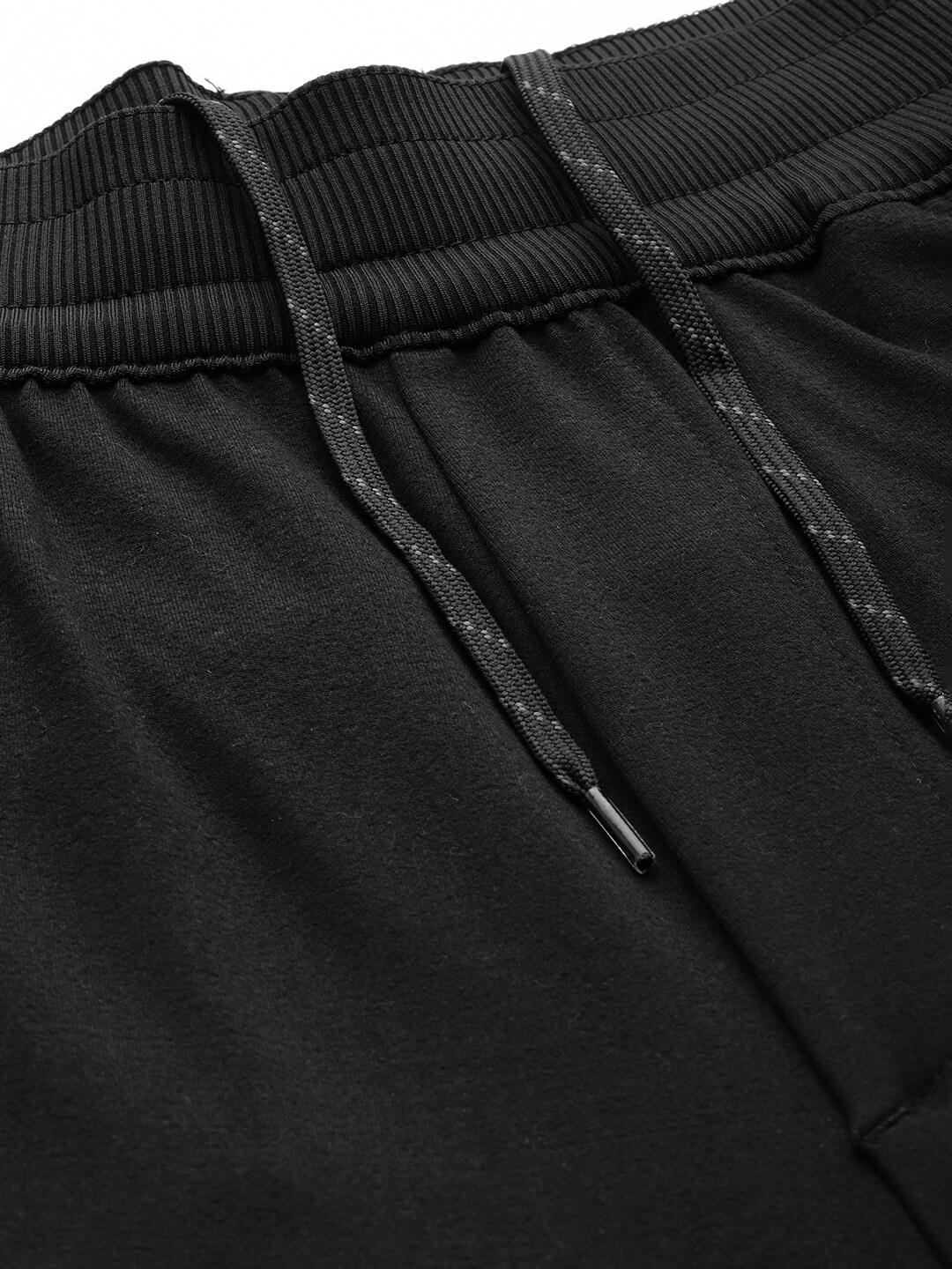 A Men Wearing Columbia Men Black Tech Trail Knit Jogger