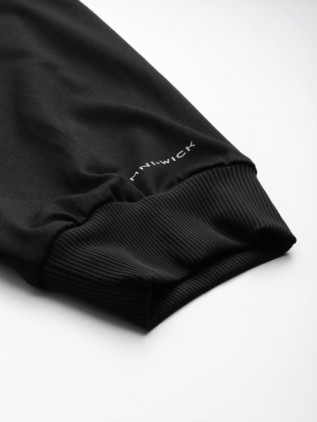 A Men Wearing Columbia Men Black Tech Trail Knit Jogger