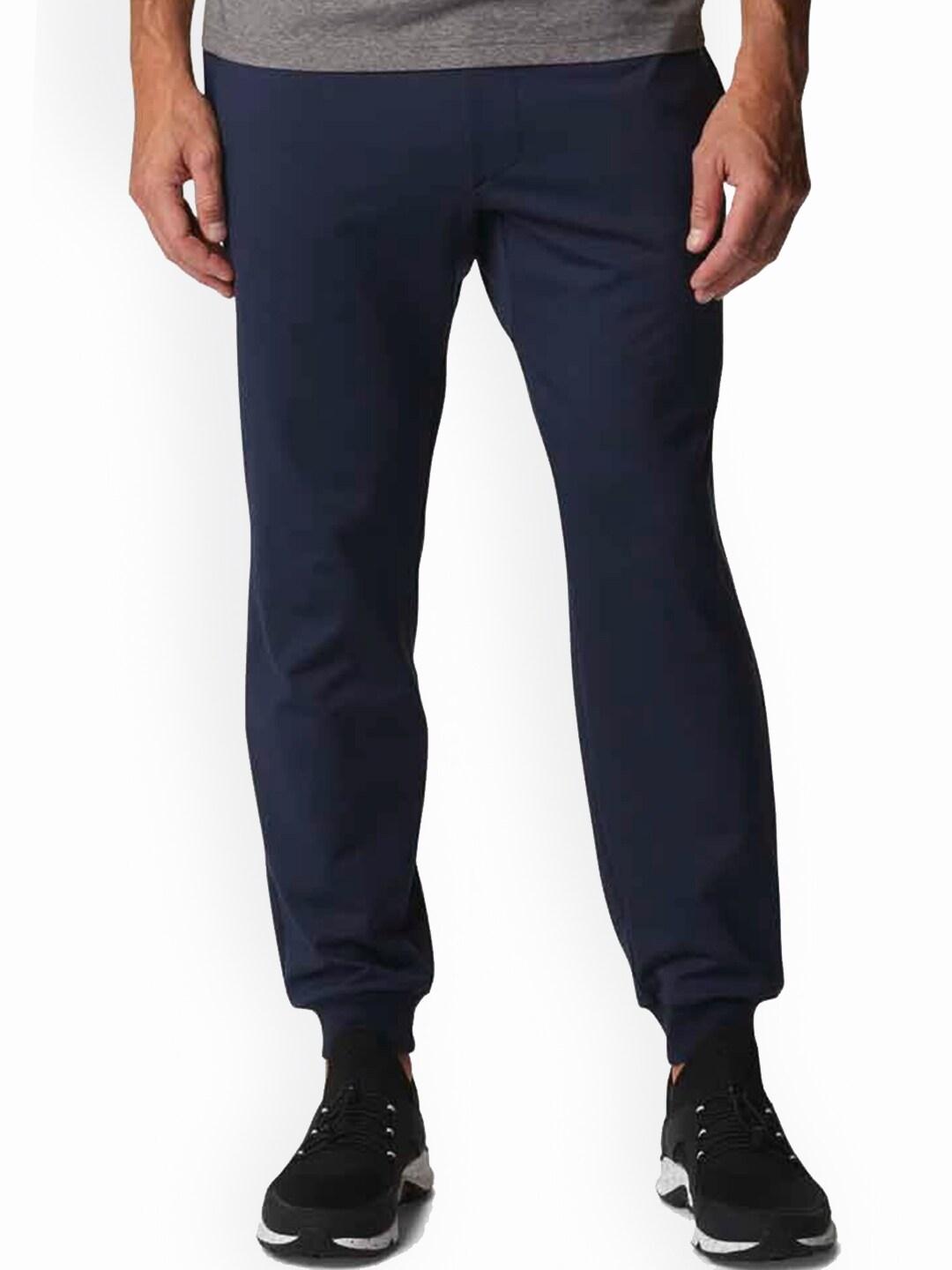 A Men Wearing Columbia Men Blue Tech Trail Knit Jogger