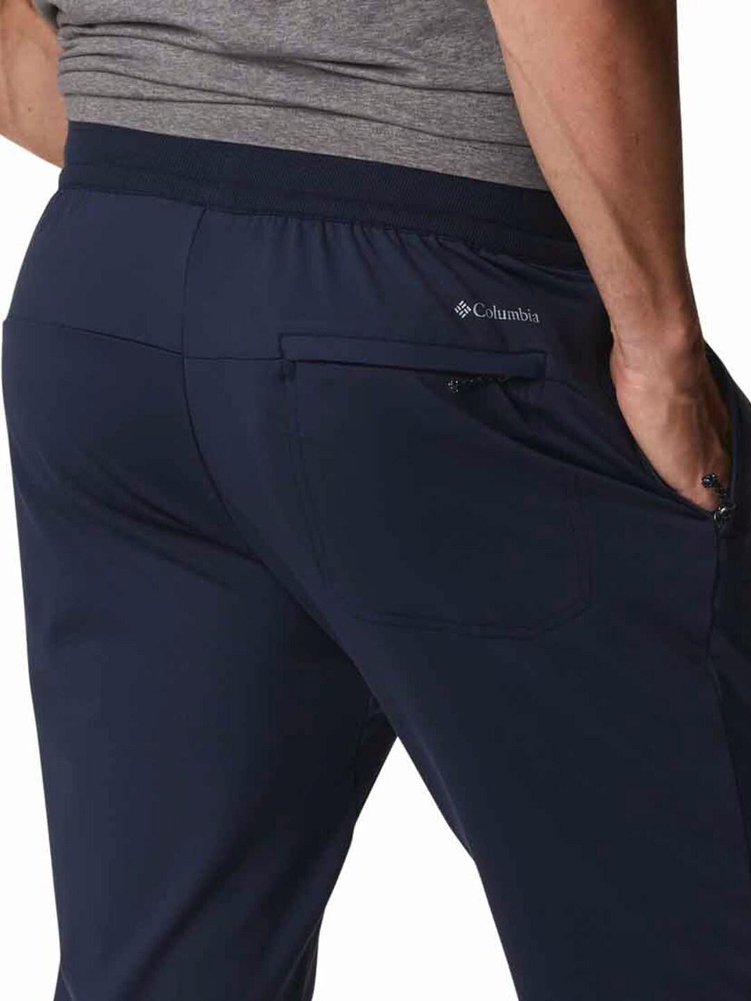 A Men Wearing Columbia Men Blue Tech Trail Knit Jogger