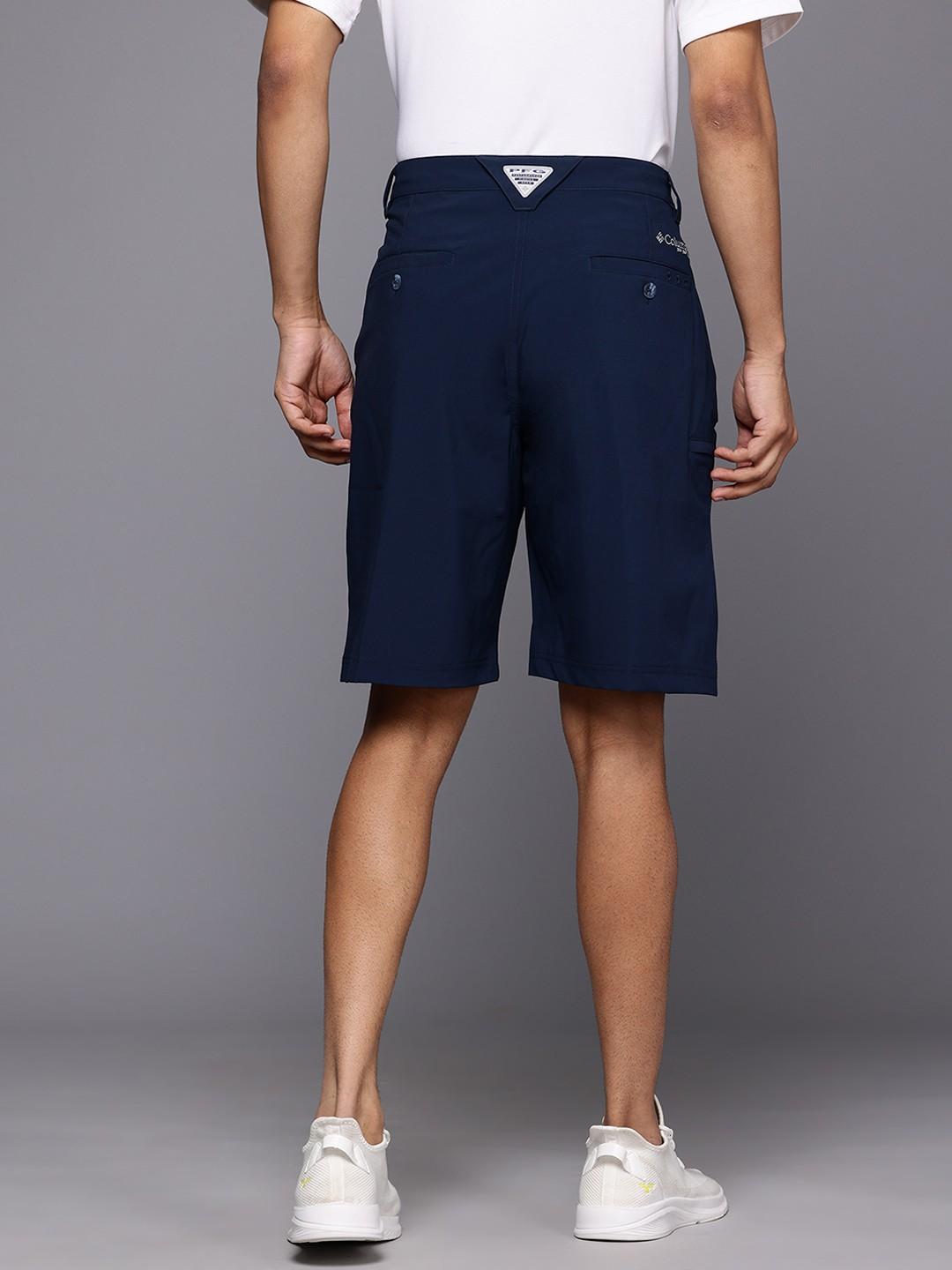 A Men Wearing Columbia Men Blue Grander Marlin III Offshore Short (Sun Protection)