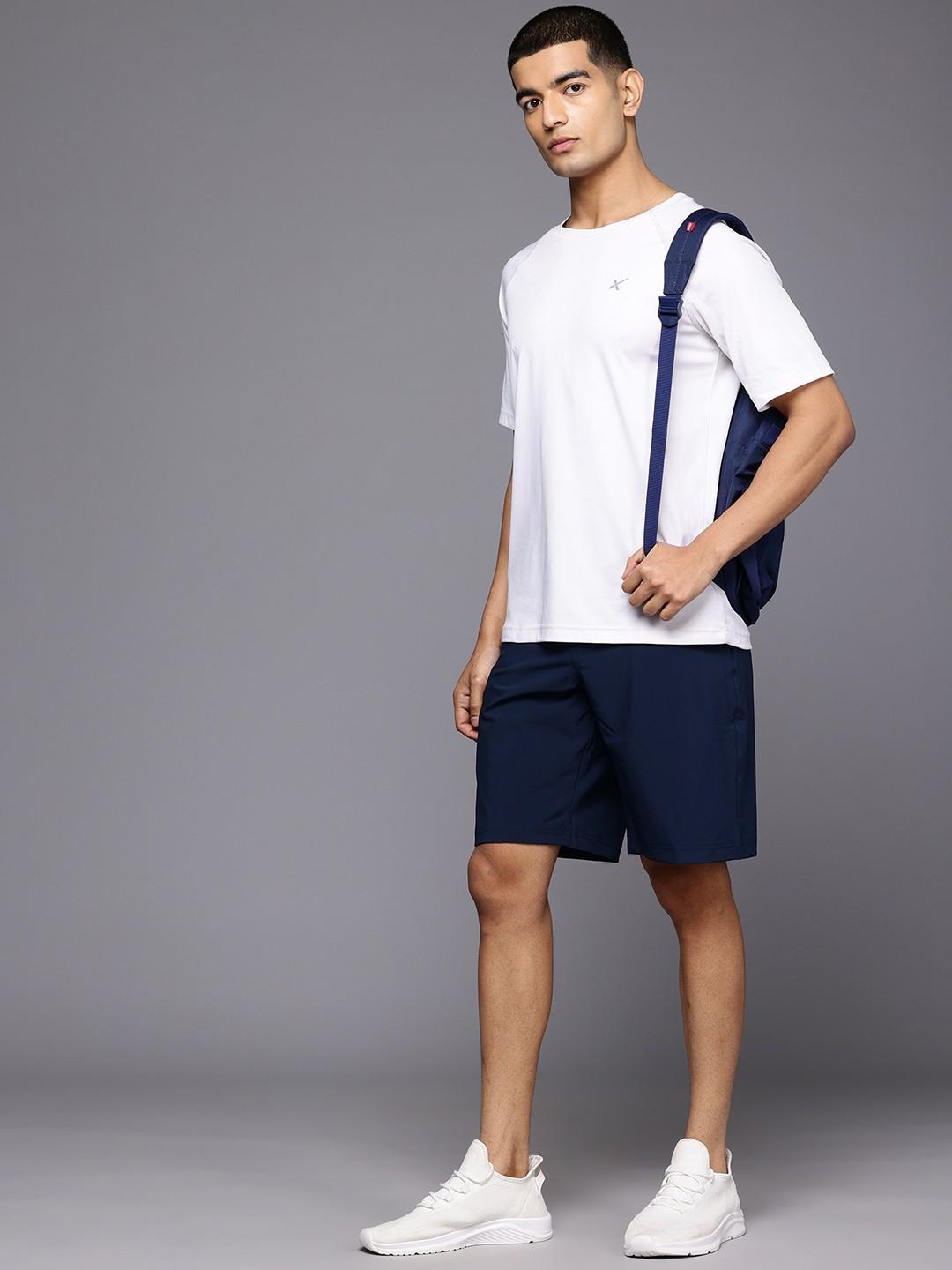 A Men Wearing Columbia Men Blue Grander Marlin III Offshore Short (Sun Protection)
