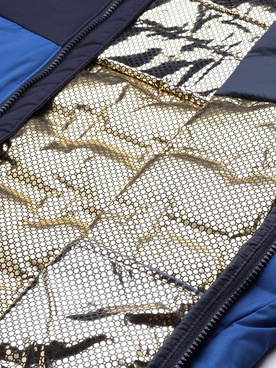 A Men Wearing Columbia Men Blue Grand Trek II Down Hooded Jacket