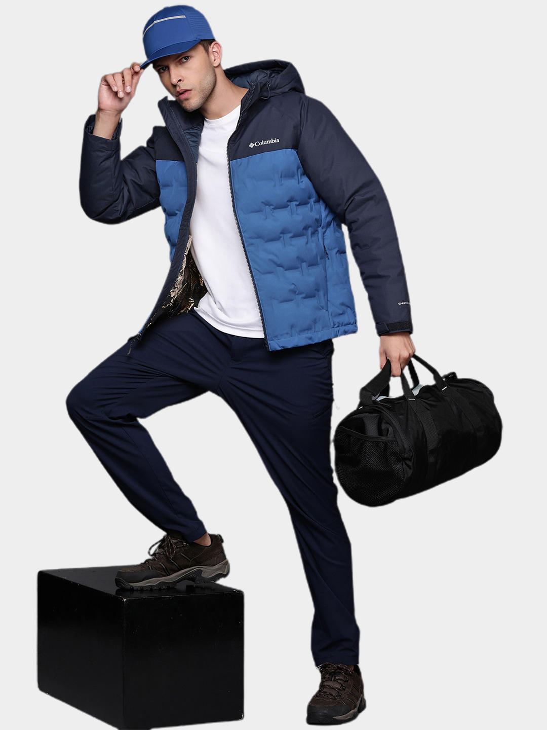 A Men Wearing Columbia Men Blue Grand Trek II Down Hooded Jacket