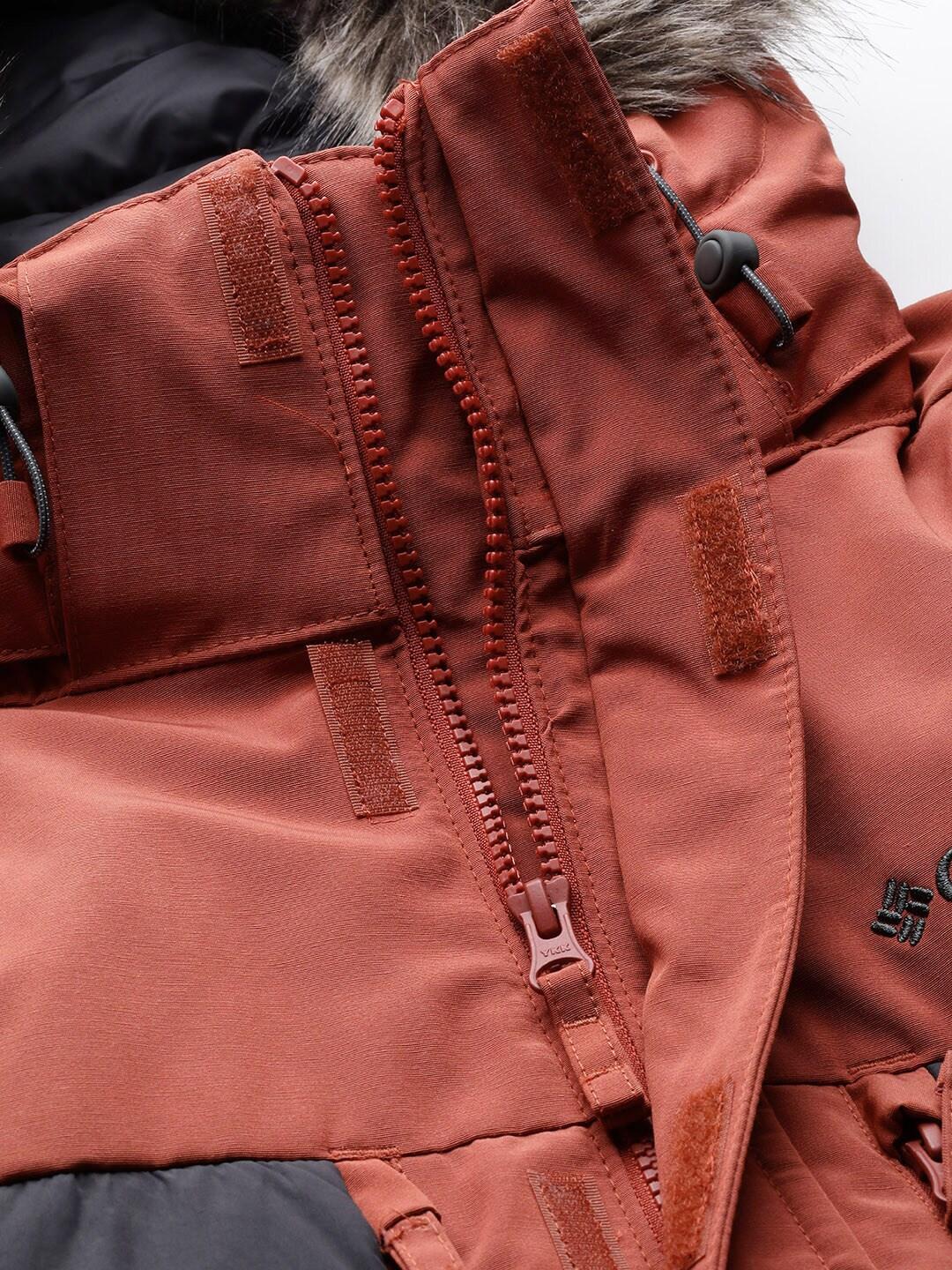 A Men Wearing Columbia Men Orange Marquam Peak Fusion Parka