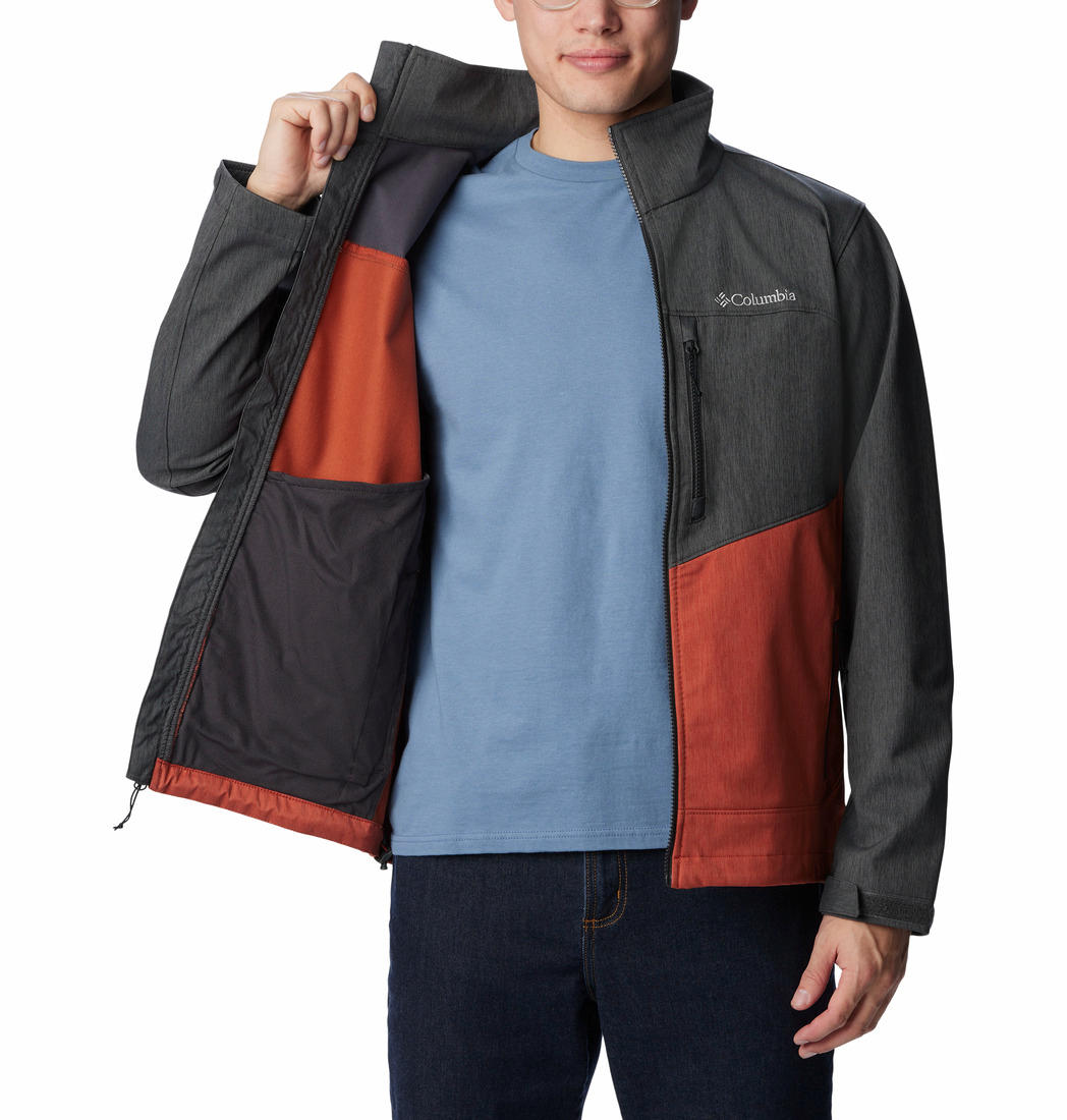 A Men Wearing Columbia Men Orange Cruiser Valley Softshell Jacket